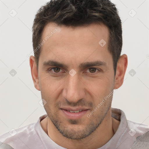 Joyful white adult male with short  brown hair and brown eyes