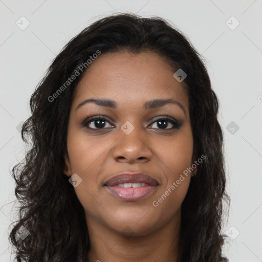 Joyful black young-adult female with long  brown hair and brown eyes