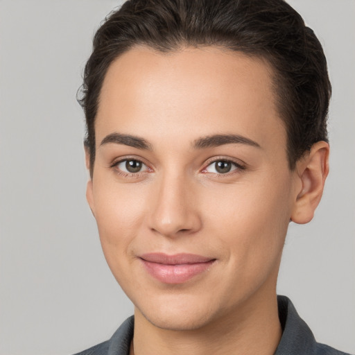 Joyful white young-adult female with short  brown hair and brown eyes