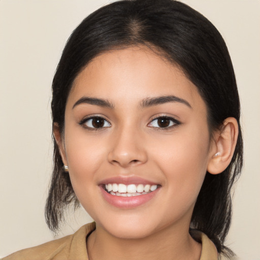 Joyful latino young-adult female with long  brown hair and brown eyes