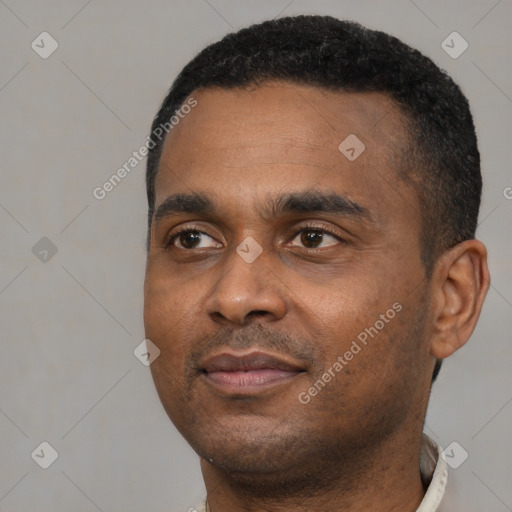 Neutral black young-adult male with short  black hair and brown eyes