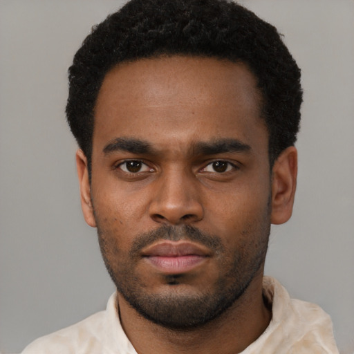 Neutral black young-adult male with short  black hair and brown eyes