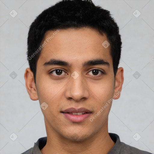 Joyful latino young-adult male with short  black hair and brown eyes