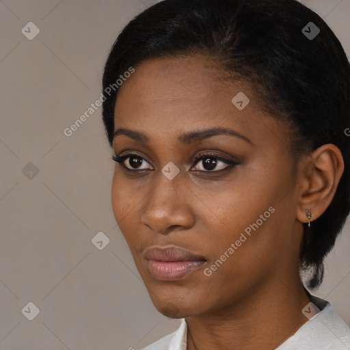 Neutral black young-adult female with short  black hair and brown eyes