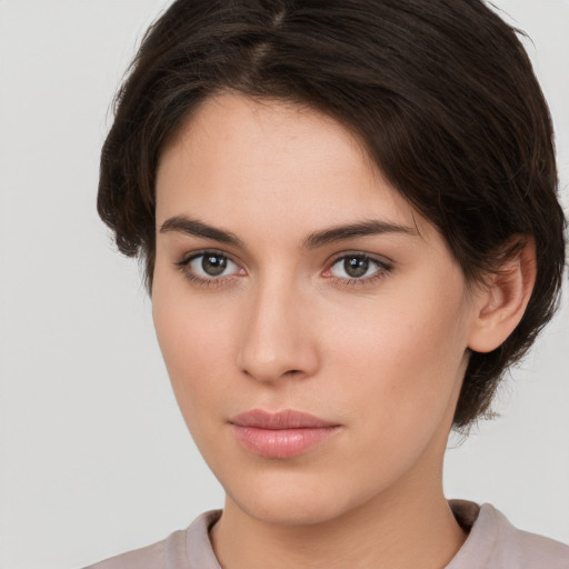 Neutral white young-adult female with medium  brown hair and brown eyes