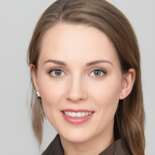 Joyful white young-adult female with long  brown hair and grey eyes