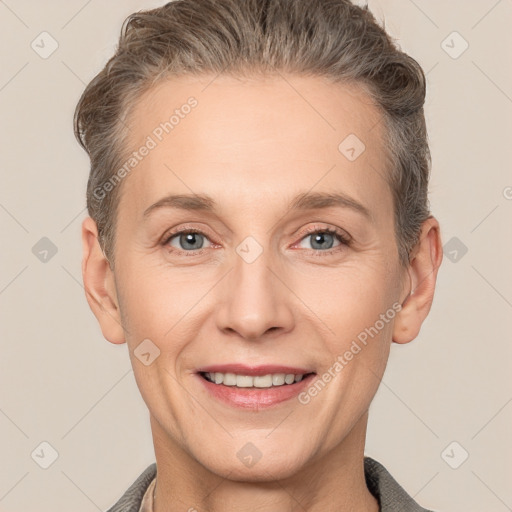 Joyful white adult female with short  brown hair and grey eyes