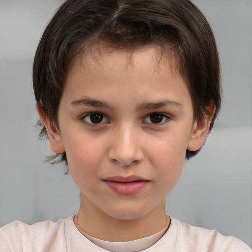 Joyful white child female with short  brown hair and brown eyes