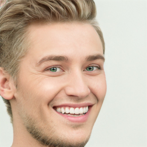 Joyful white young-adult male with short  brown hair and green eyes