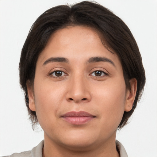 Joyful white young-adult female with medium  brown hair and brown eyes