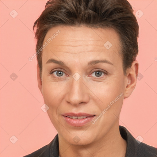 Joyful white adult female with short  brown hair and brown eyes