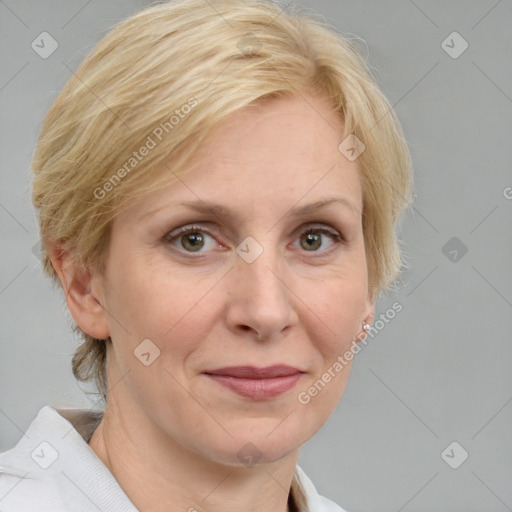 Joyful white adult female with medium  brown hair and blue eyes