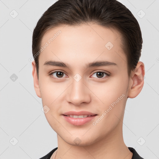 Joyful white young-adult female with short  brown hair and brown eyes