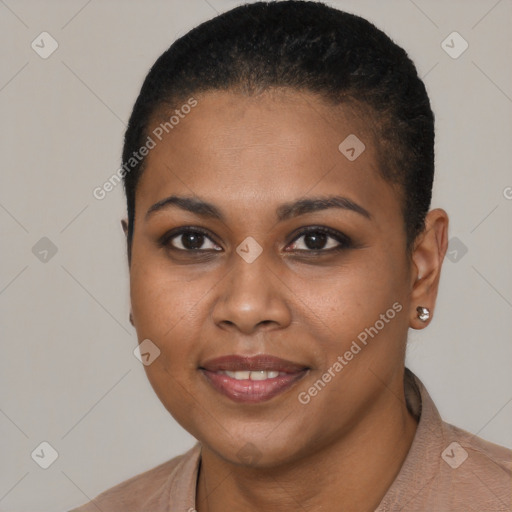 Joyful black young-adult female with short  black hair and brown eyes