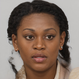 Joyful black young-adult female with medium  brown hair and brown eyes