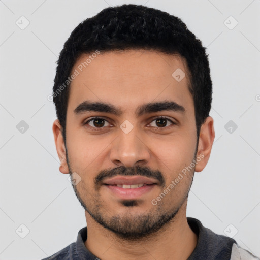 Joyful latino young-adult male with short  black hair and brown eyes