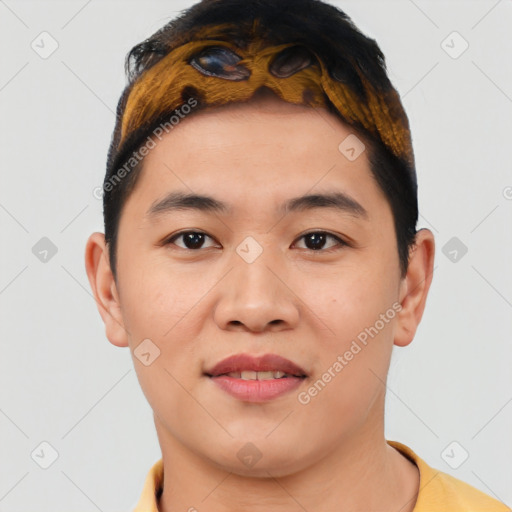 Joyful asian young-adult male with short  brown hair and brown eyes