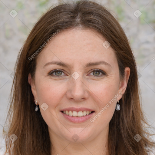 Joyful white adult female with long  brown hair and grey eyes