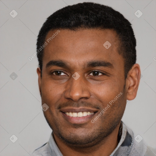 Joyful latino young-adult male with short  brown hair and brown eyes