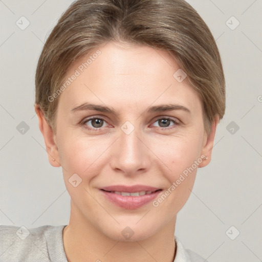 Joyful white young-adult female with short  brown hair and grey eyes