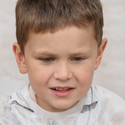 Joyful white child male with short  brown hair and brown eyes