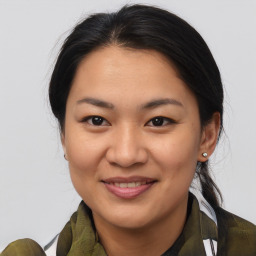 Joyful asian young-adult female with medium  brown hair and brown eyes