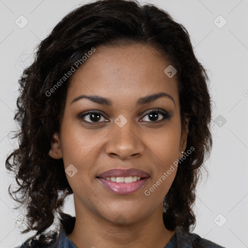 Joyful black young-adult female with long  brown hair and brown eyes