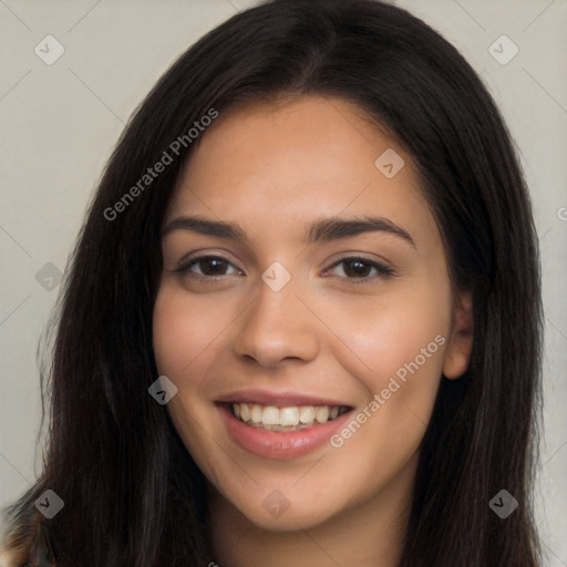 Joyful latino young-adult female with long  brown hair and brown eyes