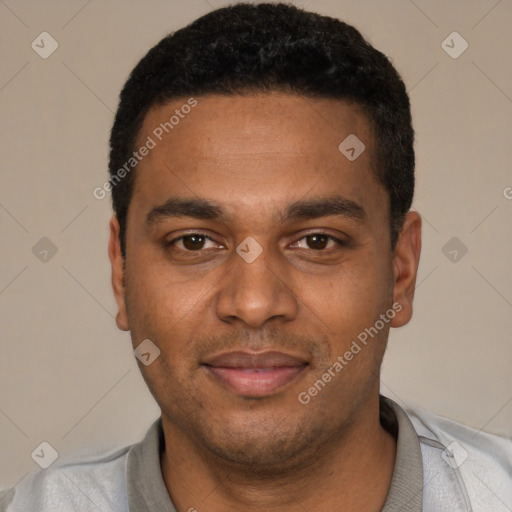 Joyful black young-adult male with short  black hair and brown eyes