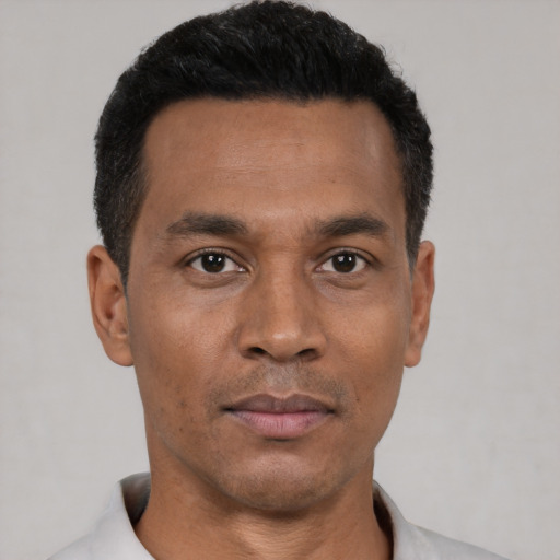 Neutral black young-adult male with short  black hair and brown eyes