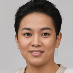 Joyful asian young-adult female with short  brown hair and brown eyes