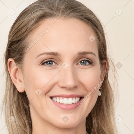 Joyful white young-adult female with long  brown hair and grey eyes