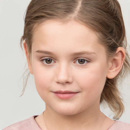 Joyful white child female with medium  brown hair and grey eyes