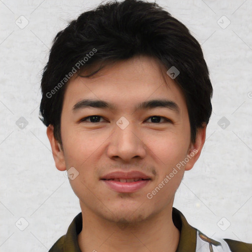 Joyful asian young-adult male with short  black hair and brown eyes