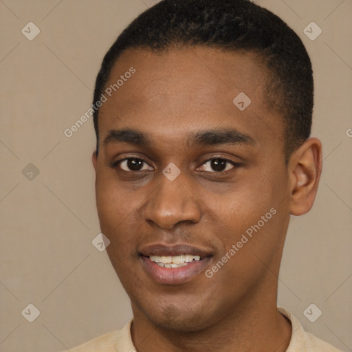 Joyful black young-adult male with short  black hair and brown eyes