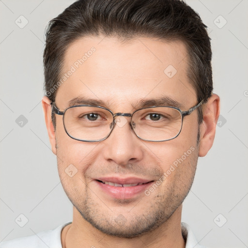 Joyful white young-adult male with short  brown hair and brown eyes