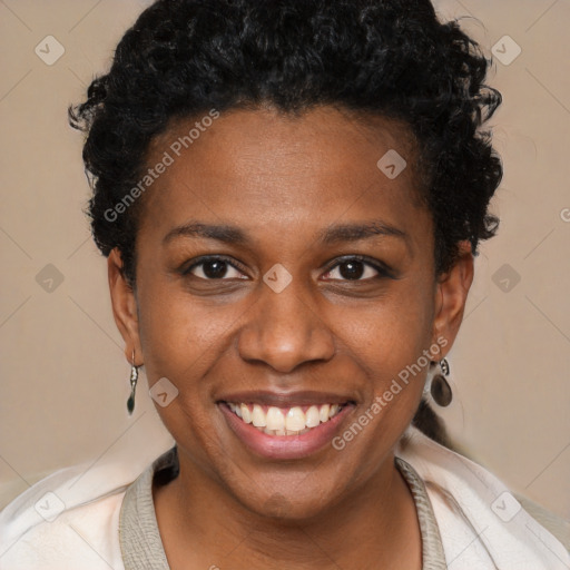 Joyful black young-adult female with short  brown hair and brown eyes