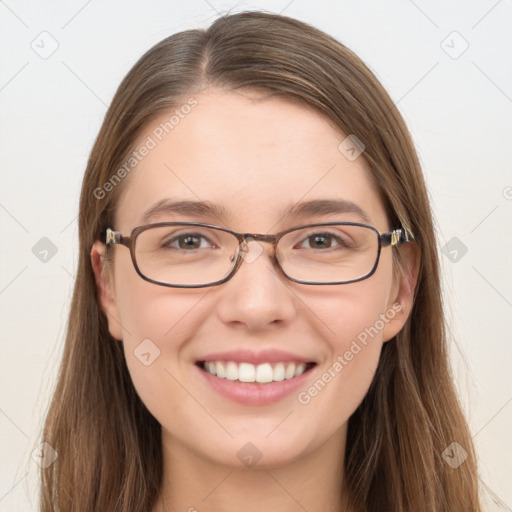 Joyful white young-adult female with long  brown hair and blue eyes