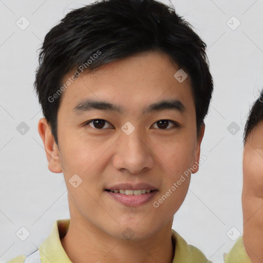 Joyful asian young-adult male with short  brown hair and brown eyes