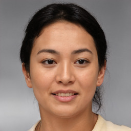 Joyful asian young-adult female with medium  brown hair and brown eyes