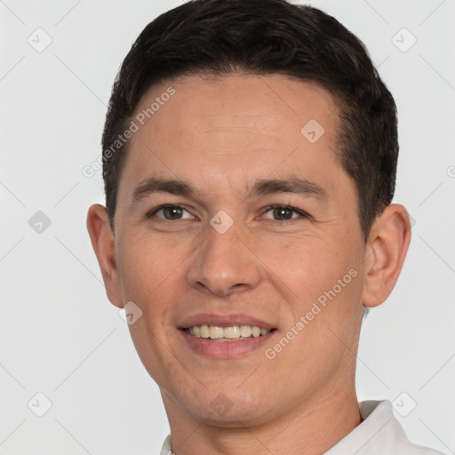 Joyful white young-adult male with short  brown hair and brown eyes