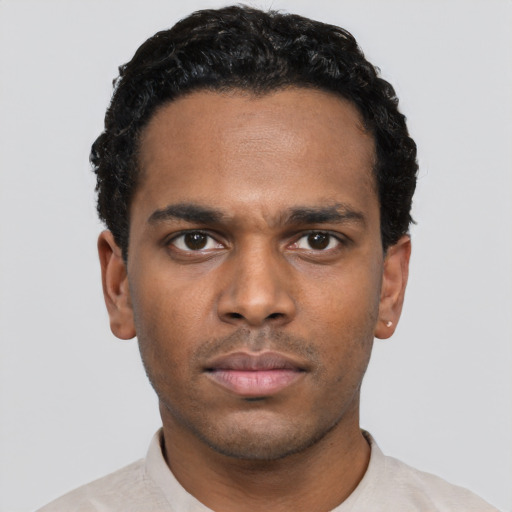 Neutral black young-adult male with short  black hair and brown eyes