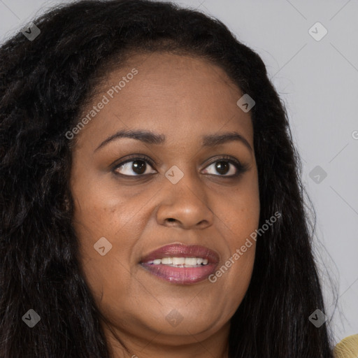 Joyful black young-adult female with long  brown hair and brown eyes