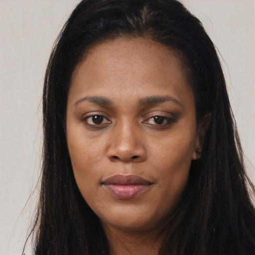 Joyful asian young-adult female with long  brown hair and brown eyes