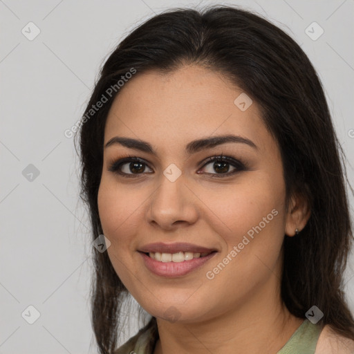 Joyful white young-adult female with long  brown hair and brown eyes