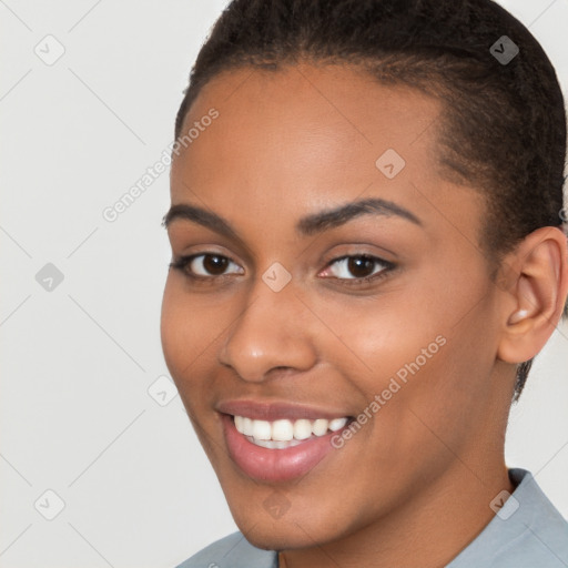 Joyful latino young-adult female with short  brown hair and brown eyes