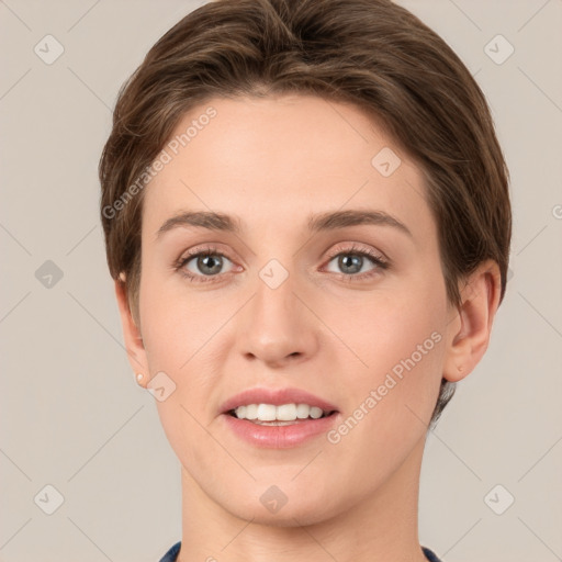 Joyful white young-adult female with short  brown hair and grey eyes