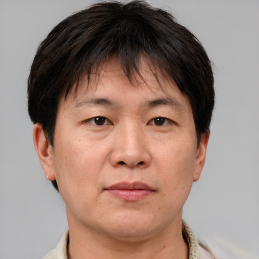 Neutral asian adult male with short  brown hair and brown eyes