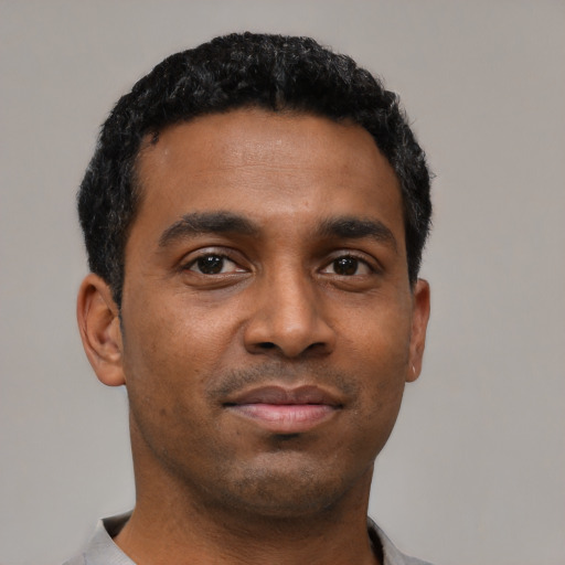 Neutral black young-adult male with short  black hair and brown eyes