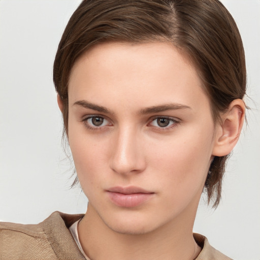 Neutral white young-adult female with short  brown hair and brown eyes